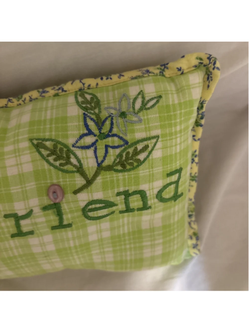April Cornell Sweet Floral Green Plaid 12”x8” Pillow. Says “Girl Friend” On It.